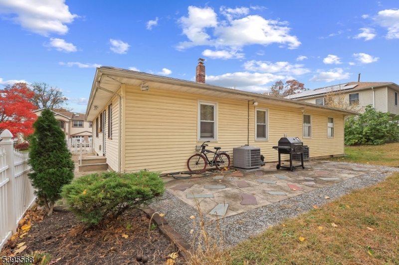 32 Ruby Street Springfield, NJ 07081 - Photo 30 of 31 a view of a chair and tables in the back yard of the house