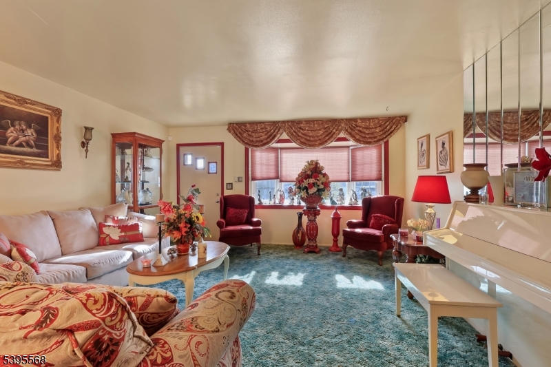 32 Ruby Street Springfield, NJ 07081 - Photo 5 of 31 a living room with furniture kitchen view and a large window