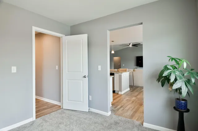 a hallway with view of living room