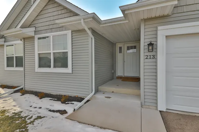 a view of a house with a wooden wall