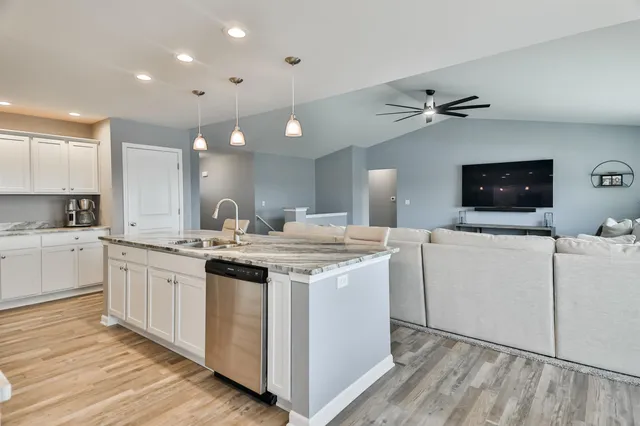 a kitchen with a sink and cabinets