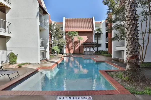 a view of a swimming pool with chairs