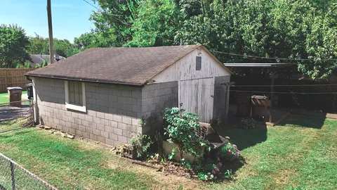 a backyard of a house with lots of green space