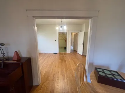 a view of a living room with wooden floor