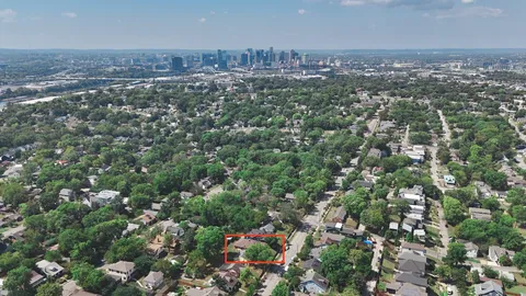 an aerial view of a houses with a yard
