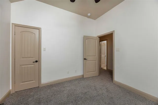a view of an empty room and closet area