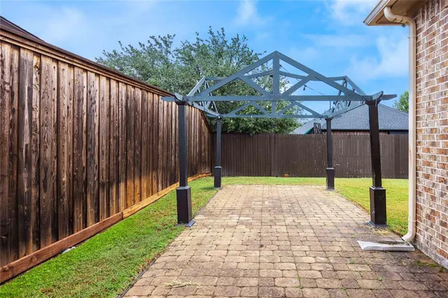 a front view of a house with a yard outdoor seating and garage