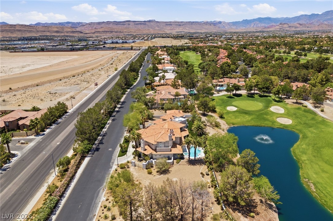 20 Innisbrook Avenue Las Vegas, NV 89113 - Photo 6 of 39 An aerial perspective reveals an exclusive golf course community with mountain views and lush landscaping.