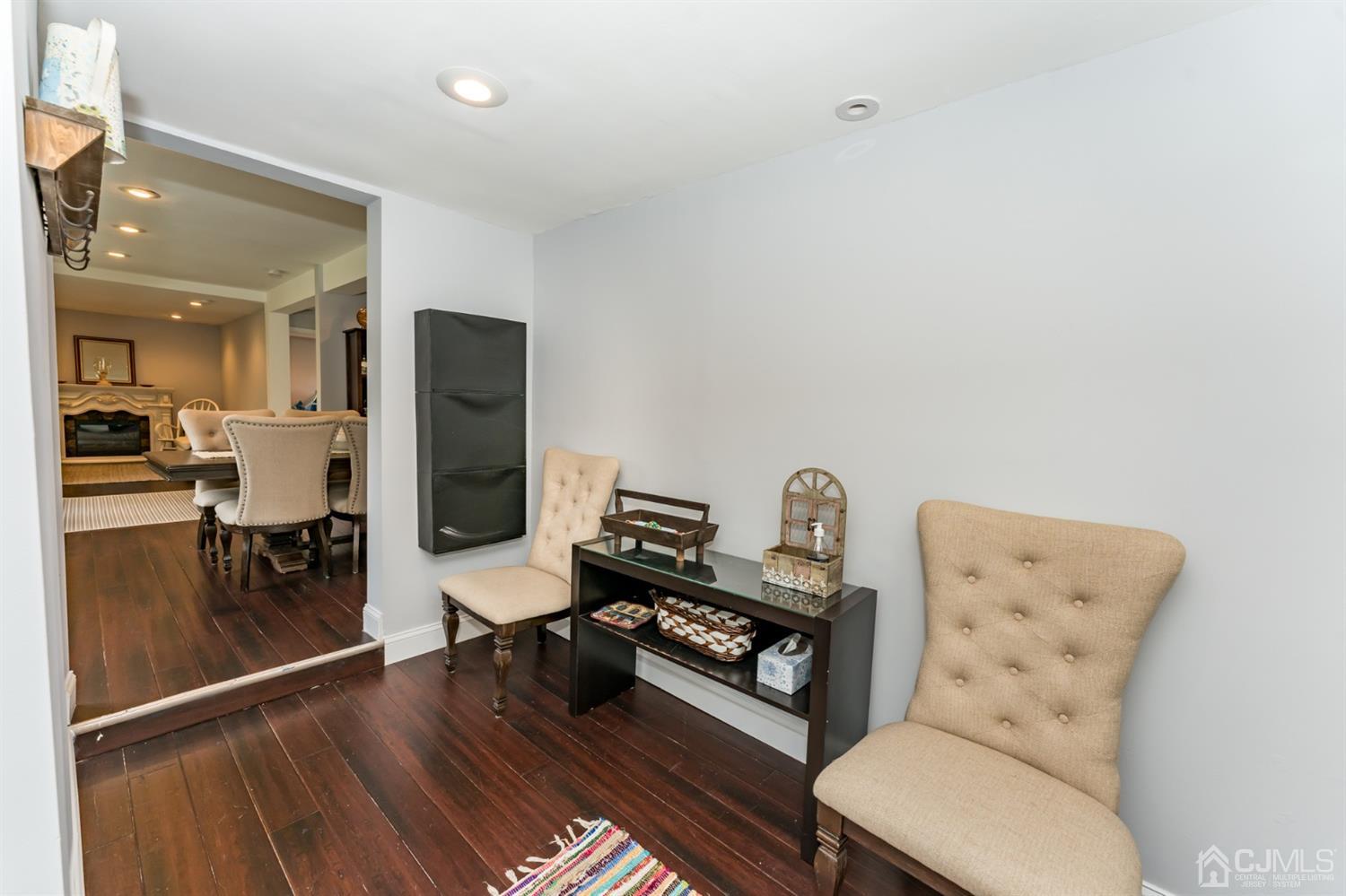259 Spring Valley Road Morganville, NJ 07751 - Photo 17 of 36 a living room with furniture and a wooden floor