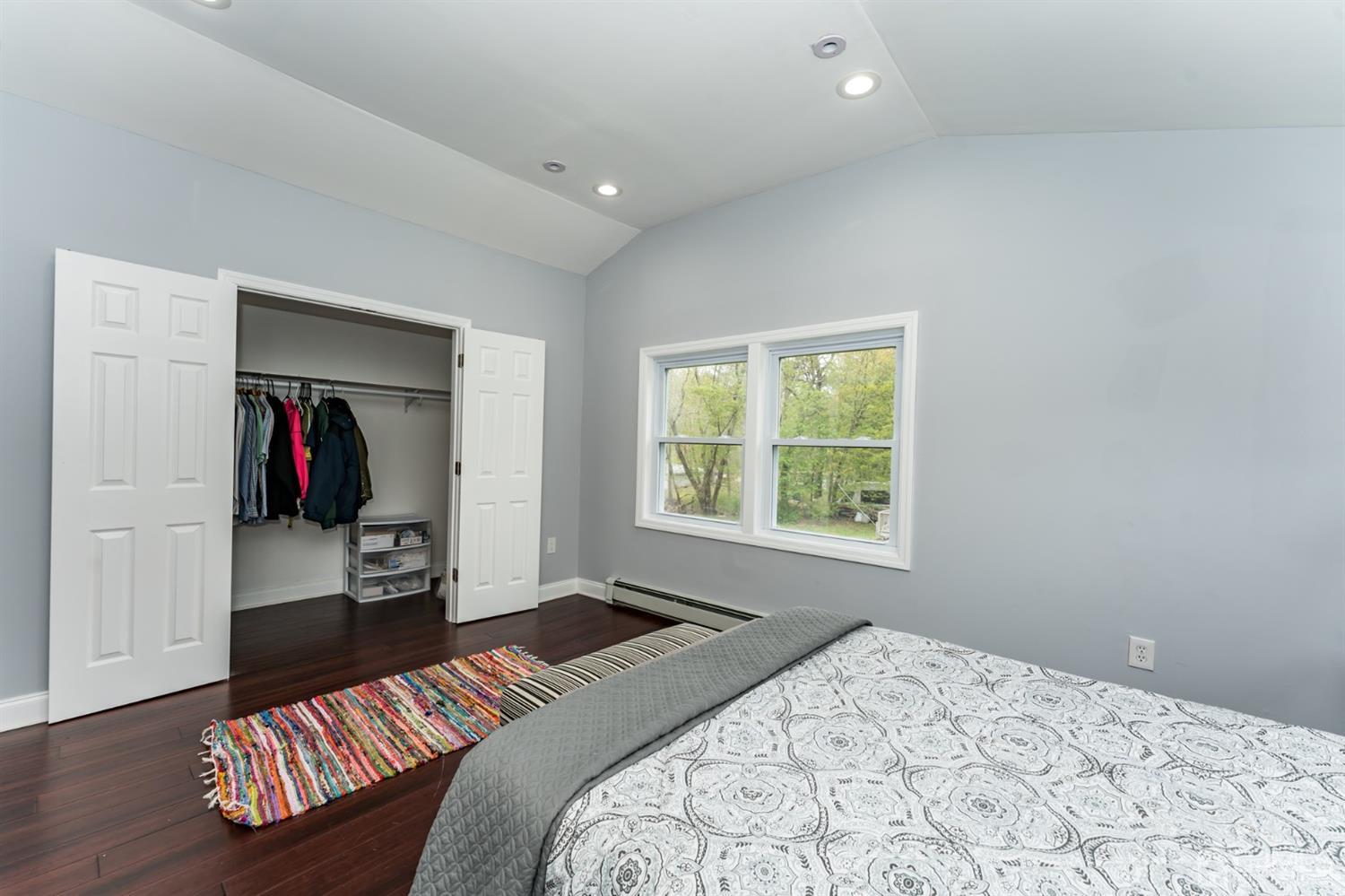 259 Spring Valley Road Morganville, NJ 07751 - Photo 23 of 36 a bedroom with a bed and a window