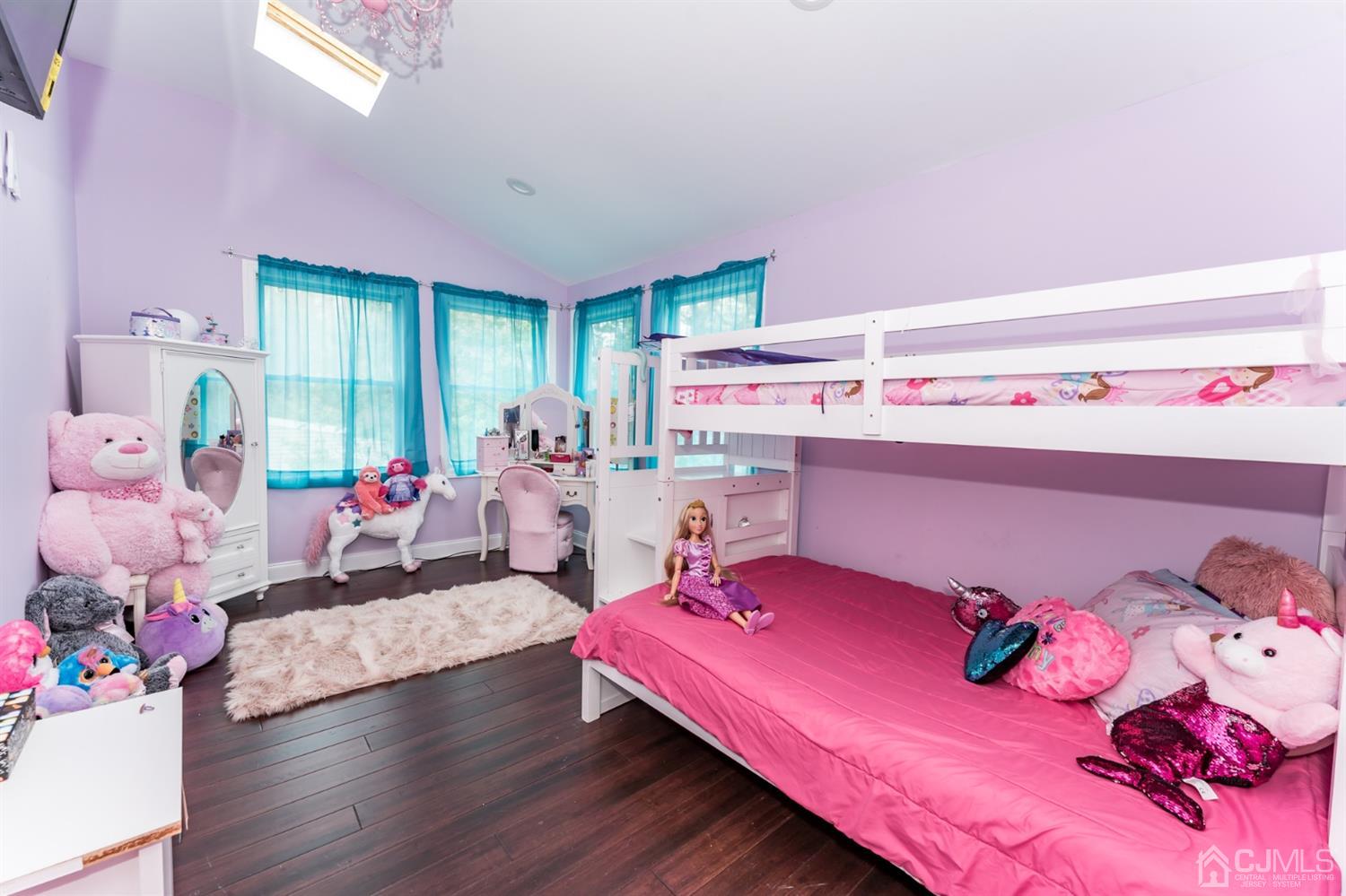259 Spring Valley Road Morganville, NJ 07751 - Photo 28 of 36 a bed room with a bed and a couch