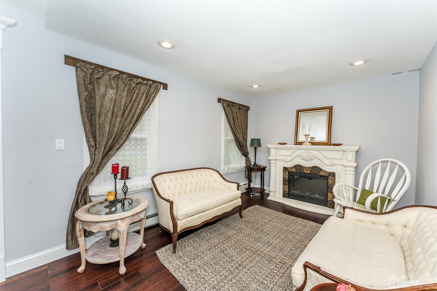 259 Spring Valley Road Morganville, NJ 07751 - Photo 4 of 36 a bedroom with furniture and a chair