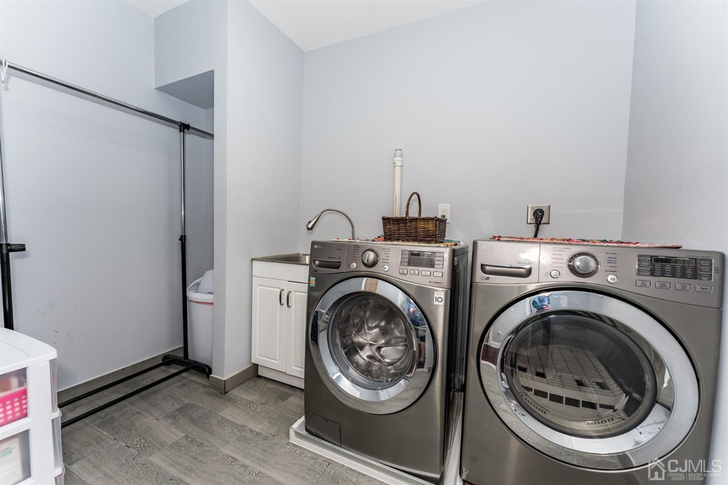 259 Spring Valley Road Morganville, NJ 07751 - Photo 31 of 36 a utility room with dryer and washer
