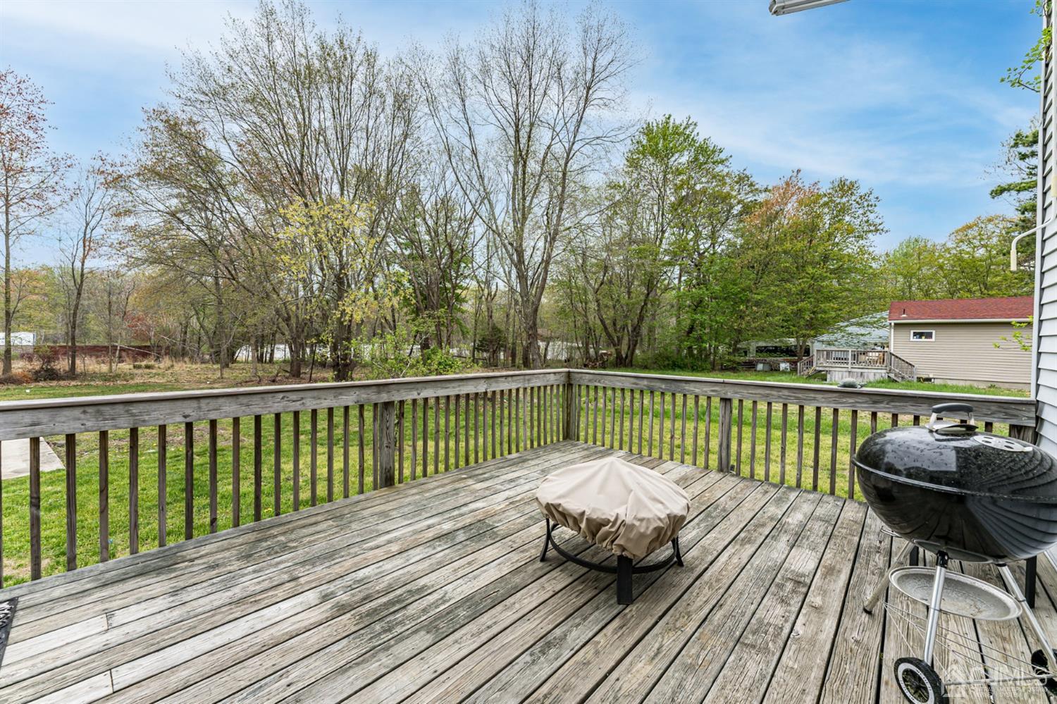 259 Spring Valley Road Morganville, NJ 07751 - Photo 32 of 36 a balcony with wooden floor and furniture