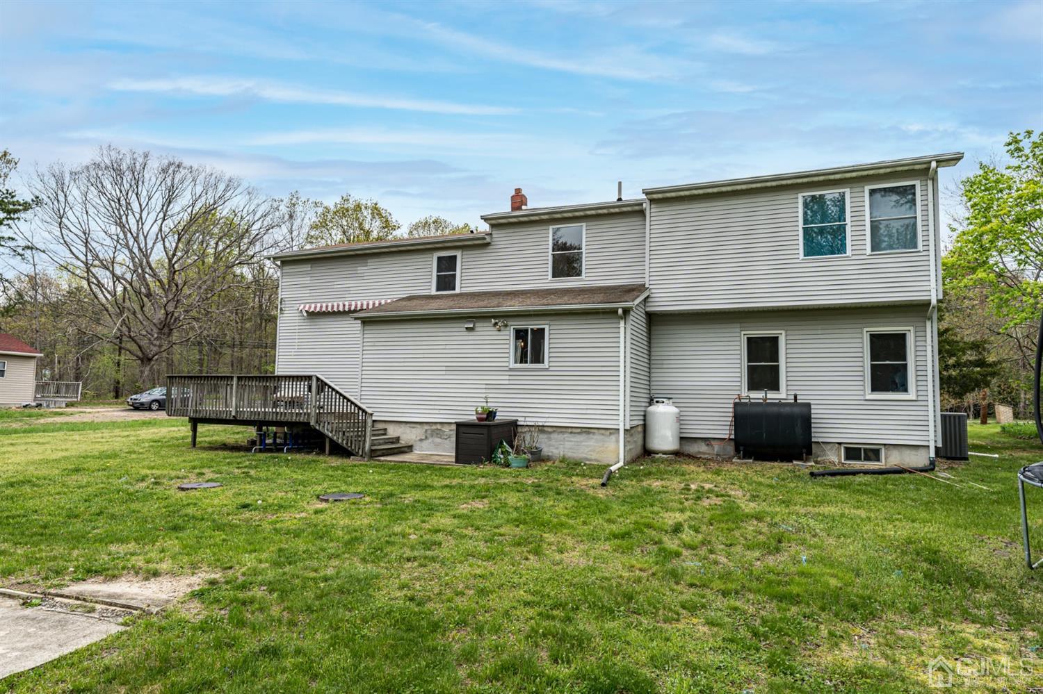 259 Spring Valley Road Morganville, NJ 07751 - Photo 35 of 36 a front view of house with yard