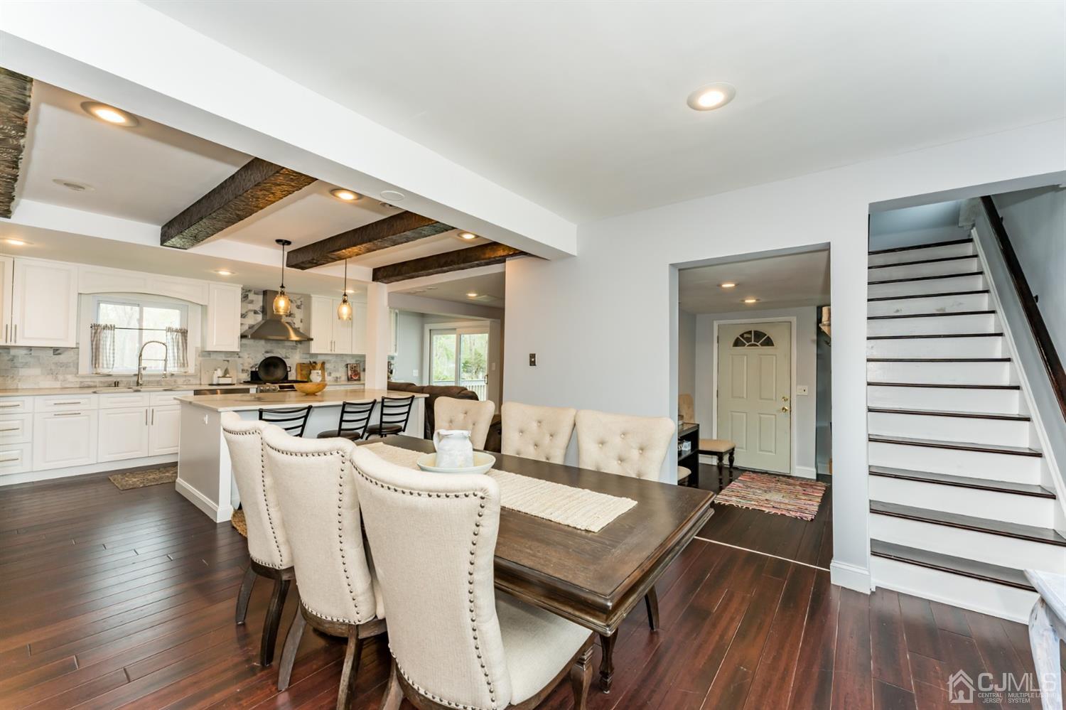 259 Spring Valley Road Morganville, NJ 07751 - Photo 6 of 36 a dining room with furniture and wooden floor