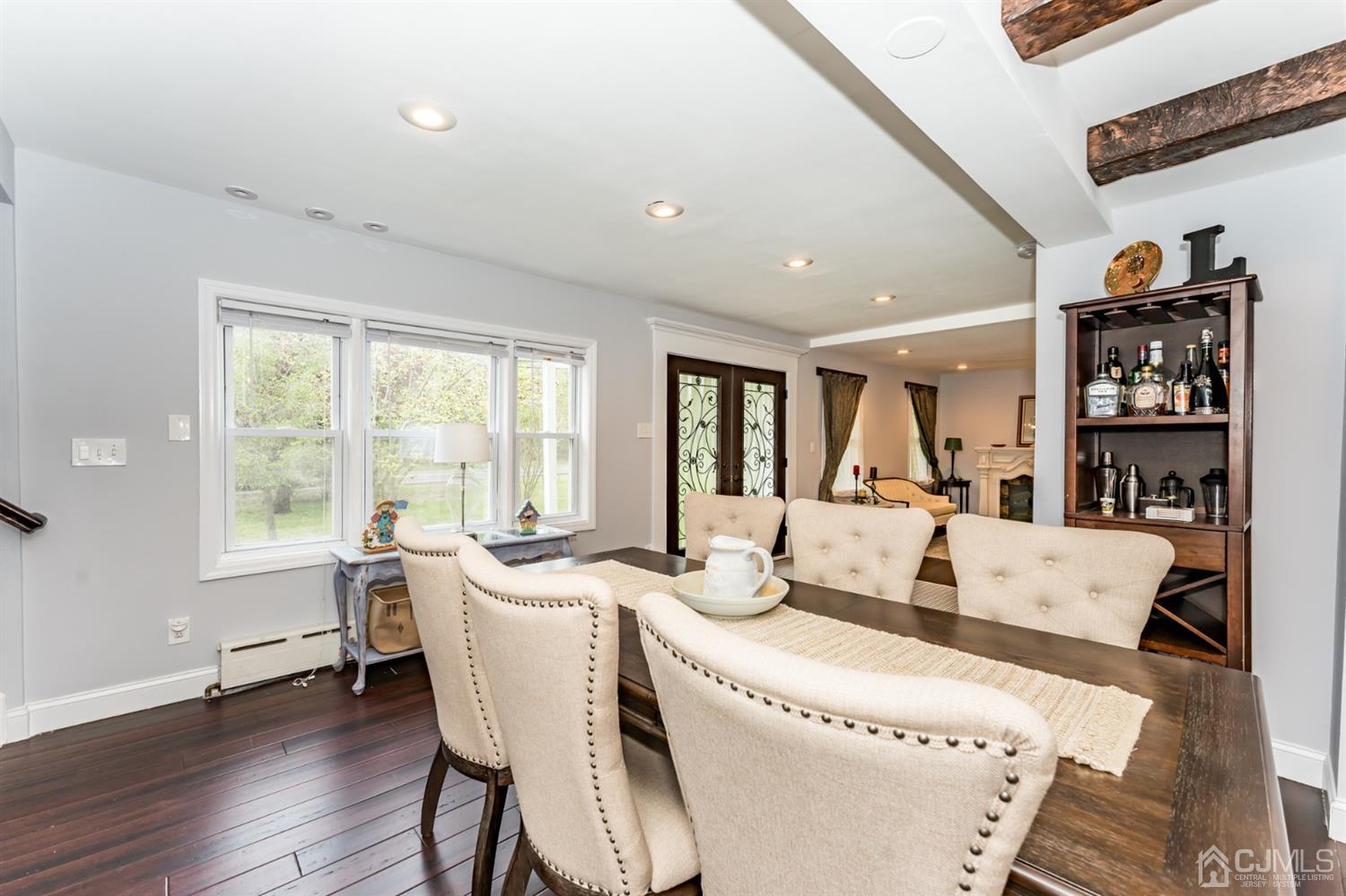 259 Spring Valley Road Morganville, NJ 07751 - Photo 7 of 36 a living room with furniture and a large window