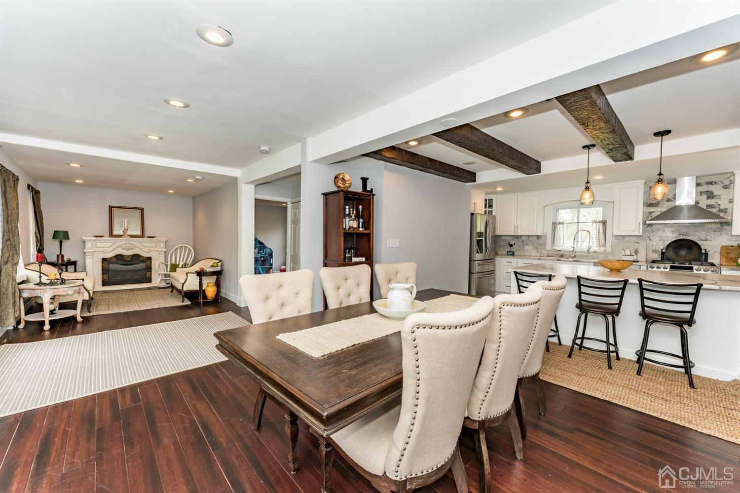 259 Spring Valley Road Morganville, NJ 07751 - Photo 8 of 36 a view of a dining room with furniture and wooden floor
