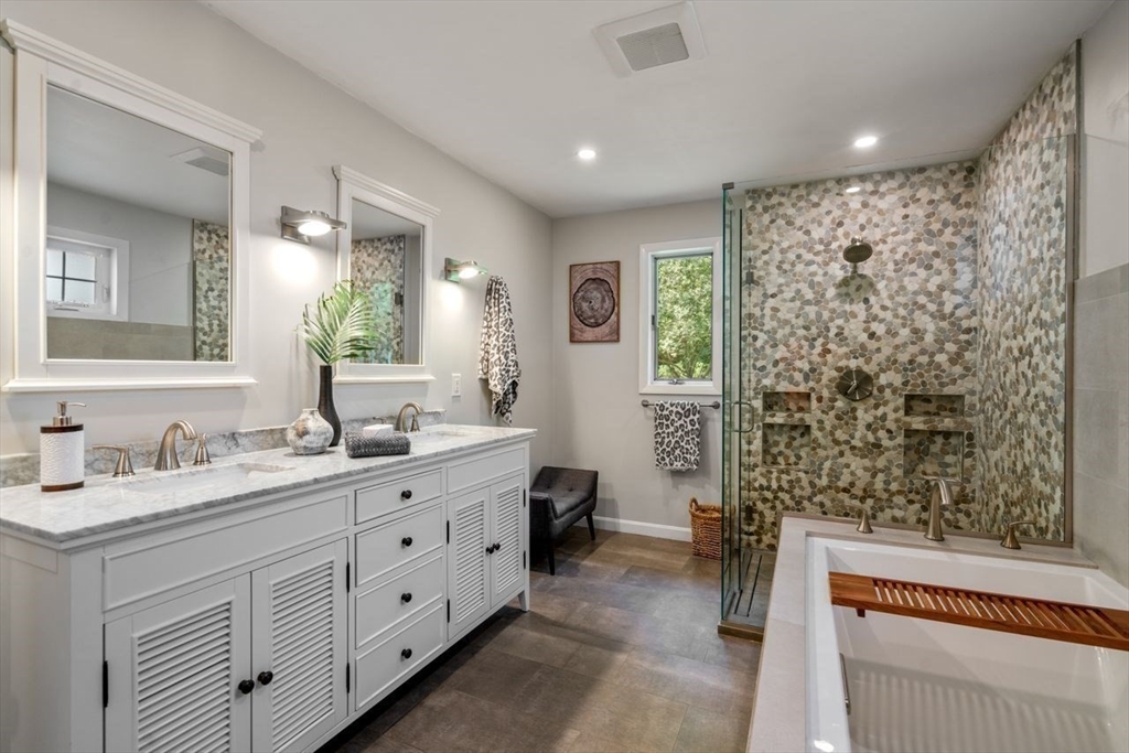 70 Lovett Road Newton, MA 02459 - Photo 20 of 37 a spacious bathroom with double vanity and a mirror