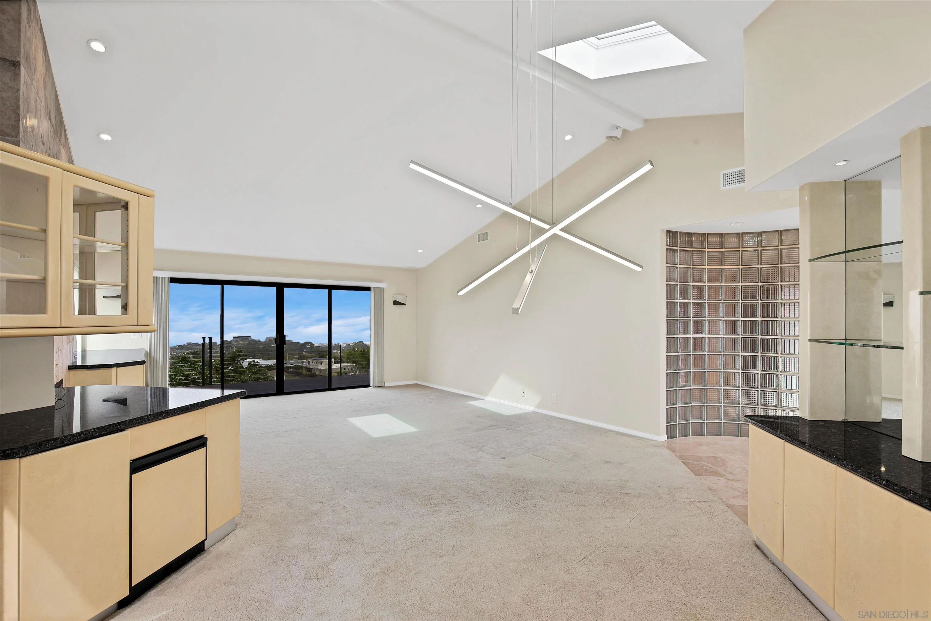 415 Marview Drive Solana Beach, CA 92075 - Photo 12 of 53 a large white kitchen with a sink and cabinets