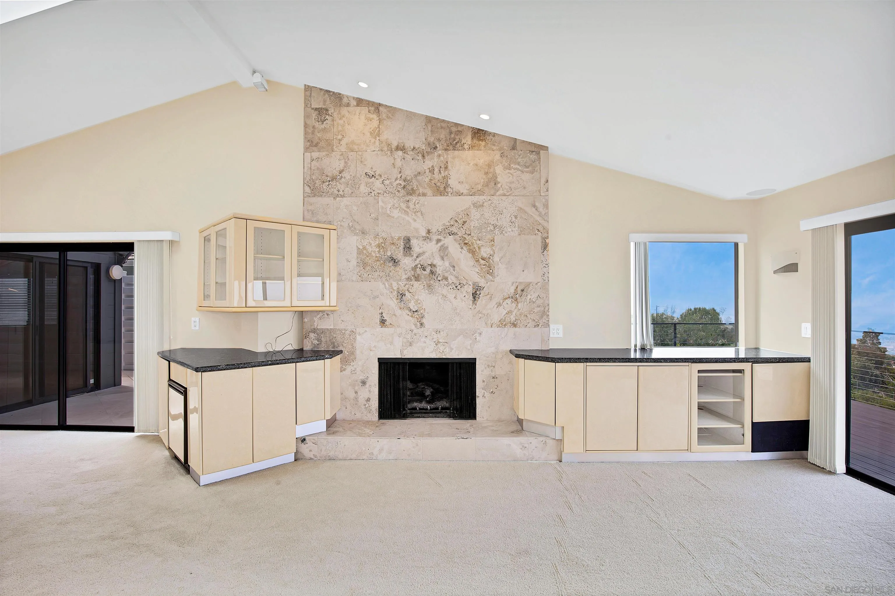 415 Marview Drive Solana Beach, CA 92075 - Photo 13 of 53 a living room with stainless steel appliances kitchen island granite countertop furniture and a fireplace