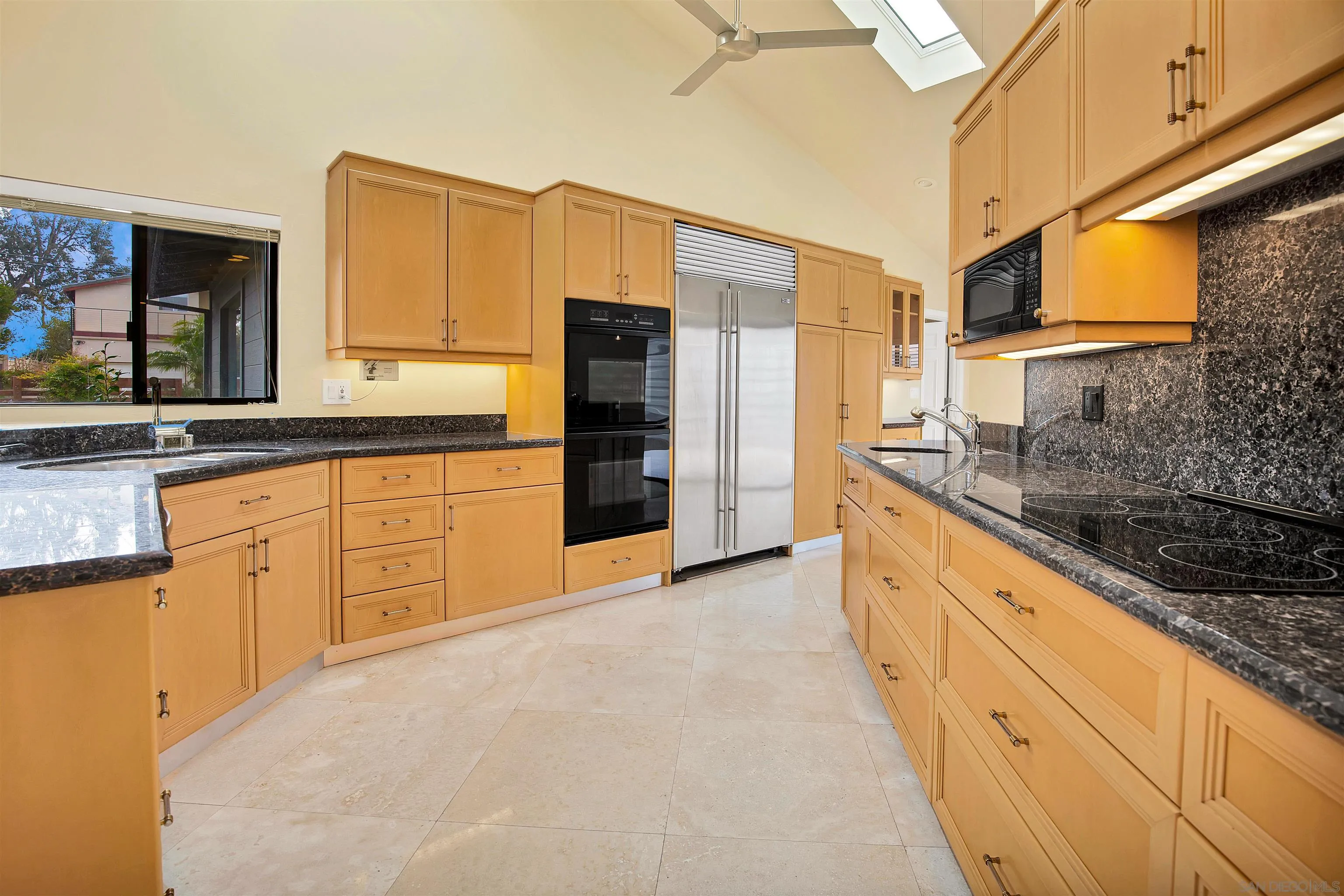 415 Marview Drive Solana Beach, CA 92075 - Photo 14 of 53 a large kitchen with stainless steel appliances granite countertop a stove and a sink