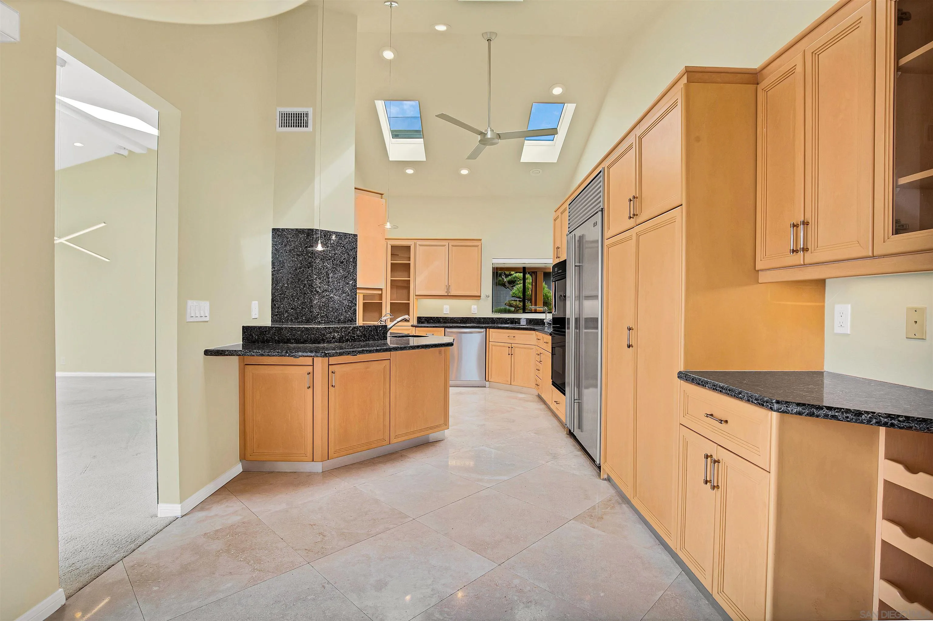 415 Marview Drive Solana Beach, CA 92075 - Photo 16 of 53 a kitchen with stainless steel appliances granite countertop a refrigerator a stove and a sink