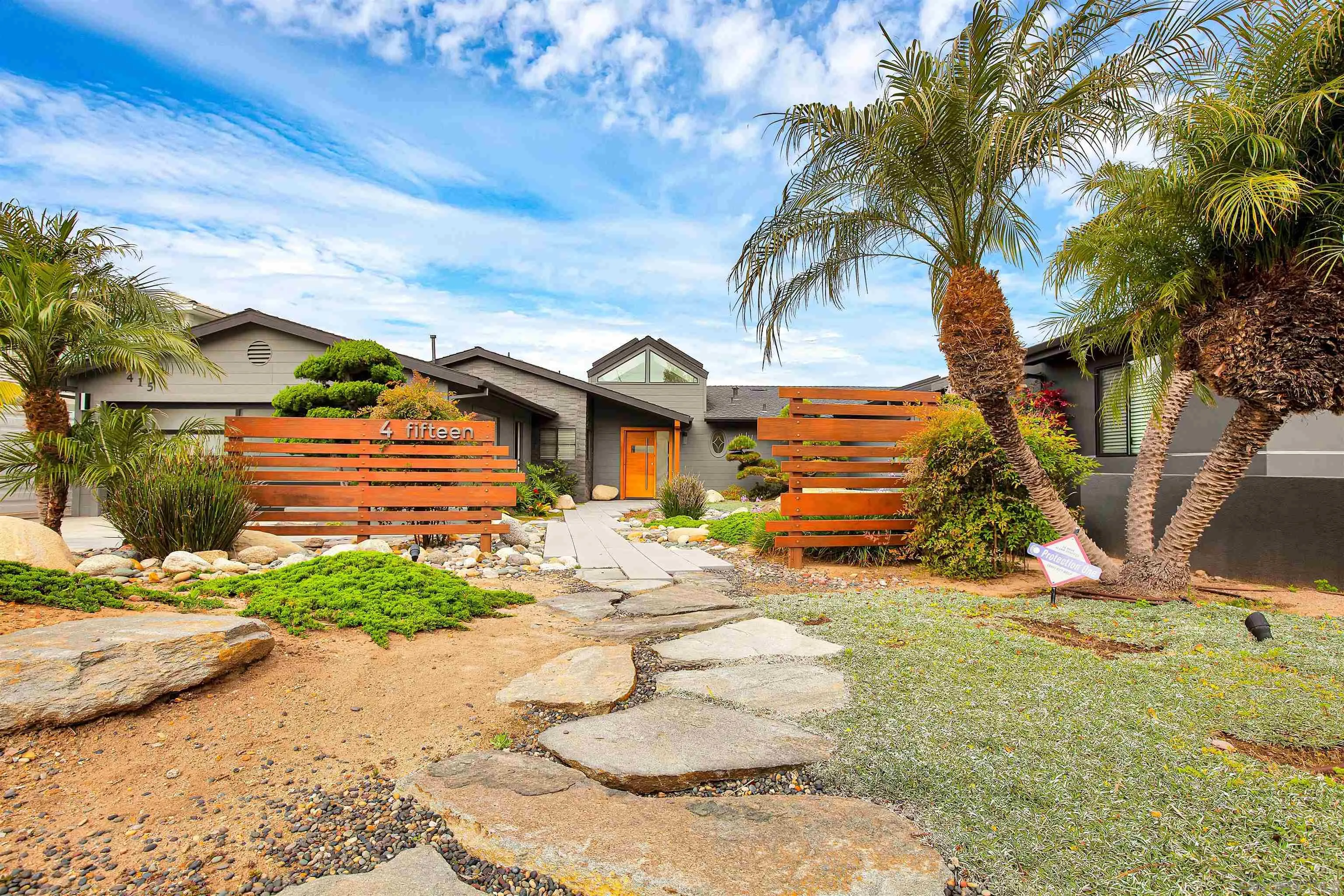 415 Marview Drive Solana Beach, CA 92075 - Photo 3 of 53 a backyard of a house with table and chairs