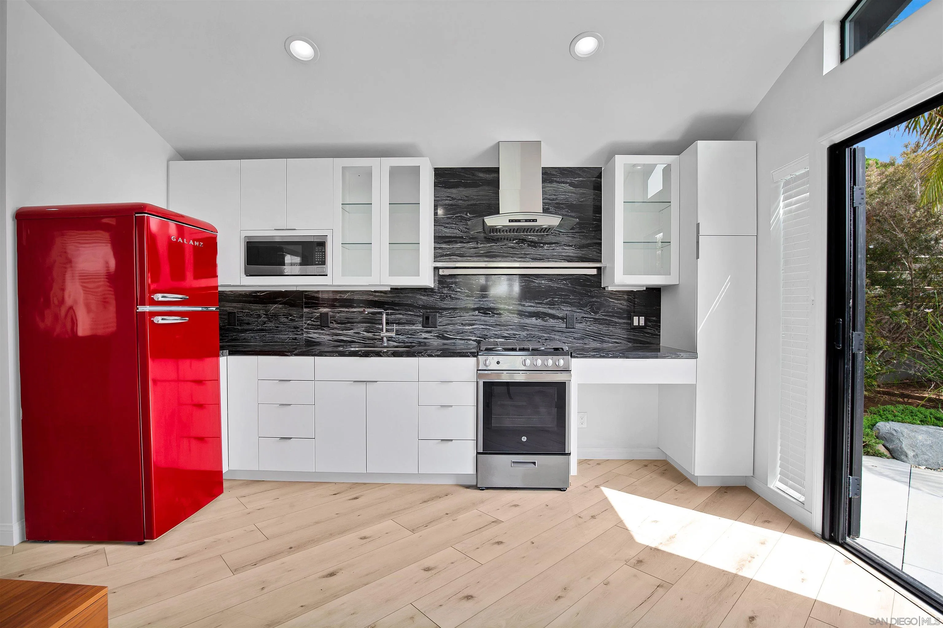 415 Marview Drive Solana Beach, CA 92075 - Photo 34 of 53 a kitchen with stainless steel appliances granite countertop a refrigerator and a stove