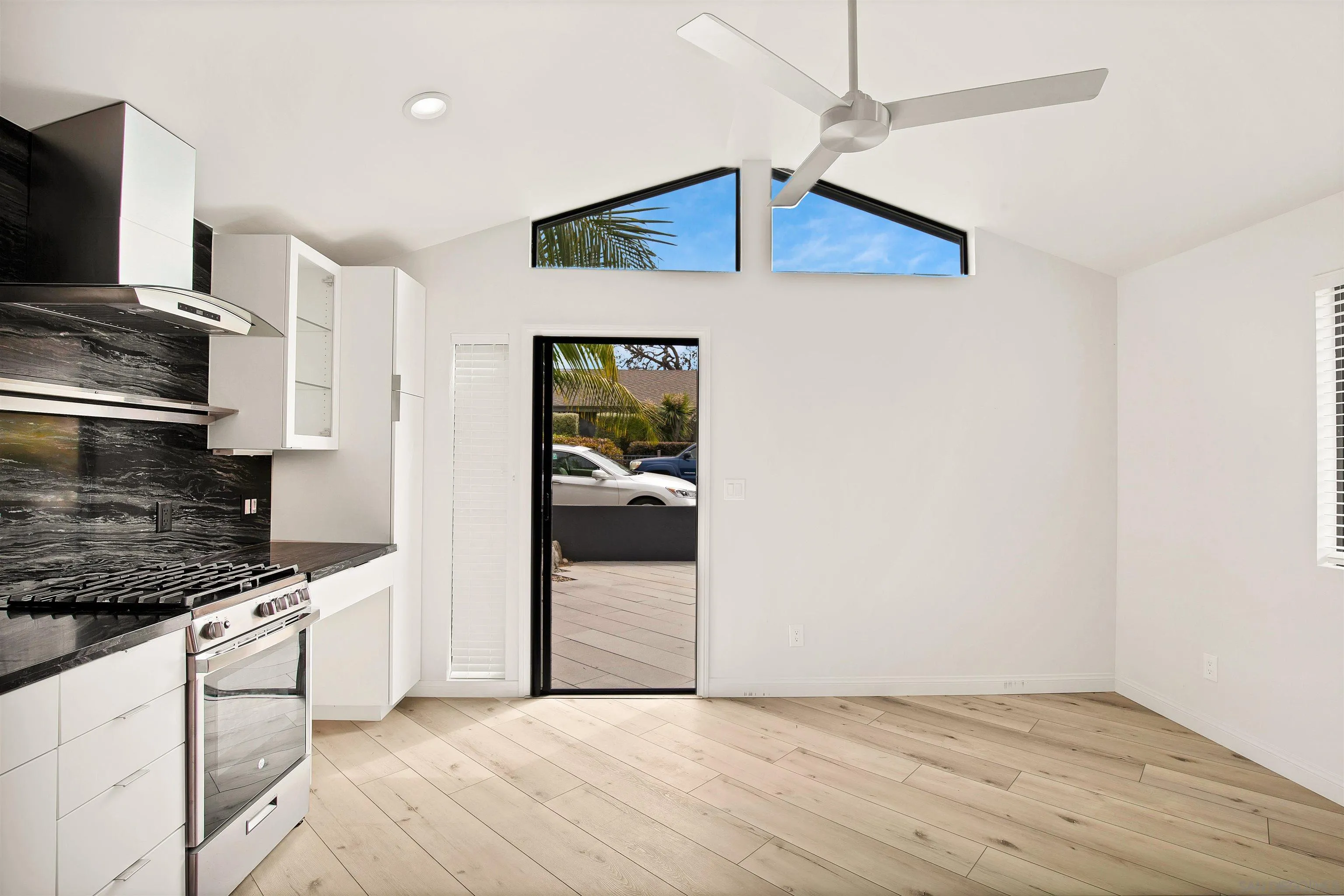 415 Marview Drive Solana Beach, CA 92075 - Photo 35 of 53 a kitchen with stainless steel appliances a white cabinet and a refrigerator