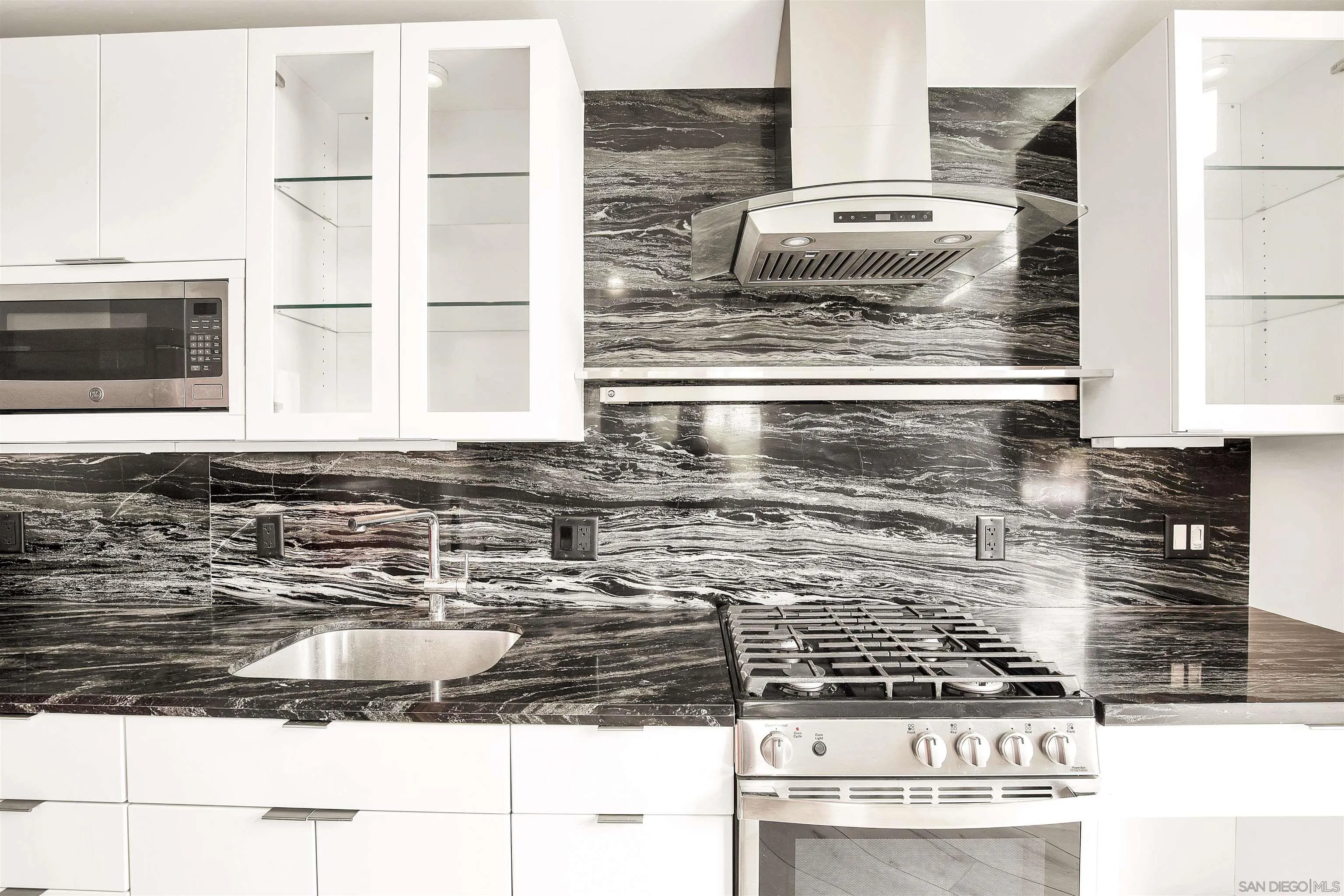 415 Marview Drive Solana Beach, CA 92075 - Photo 37 of 53 a kitchen with kitchen island granite countertop a sink and a stove