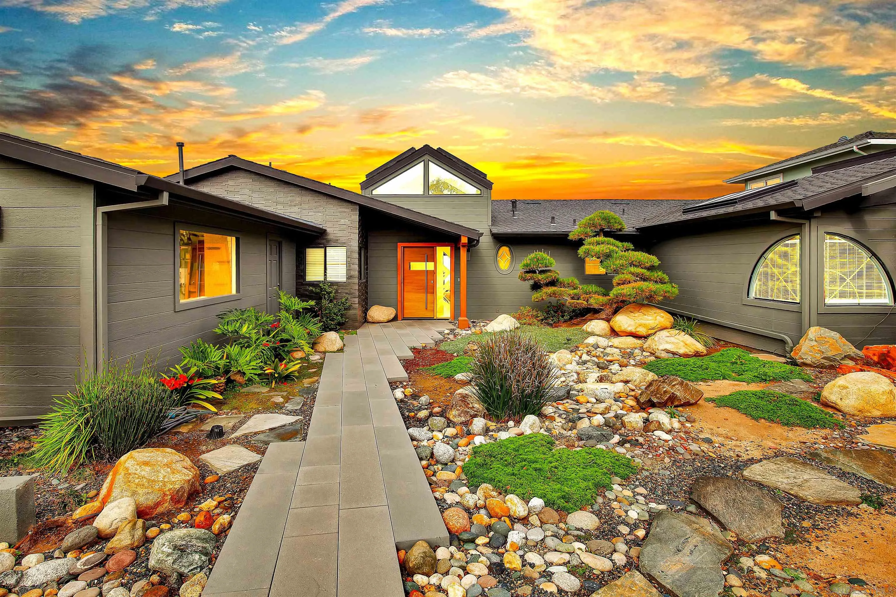 415 Marview Drive Solana Beach, CA 92075 - Photo 4 of 53 a front view of a house with a yard and a garden