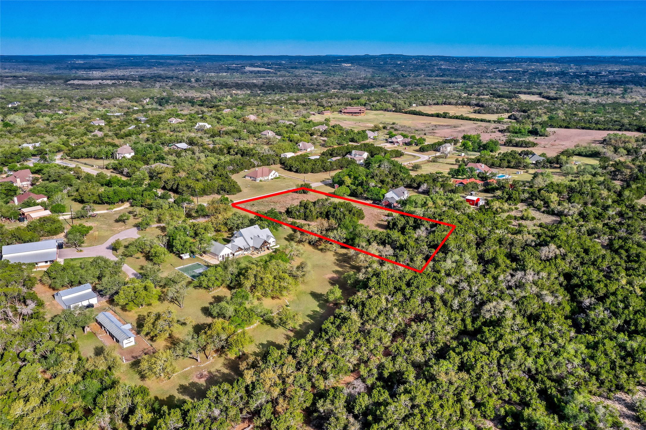 14034 Timberline Trail Austin, TX 78737 - Photo 3 of 17 Aerial view of property and surrounding area featuring property parcel outlined