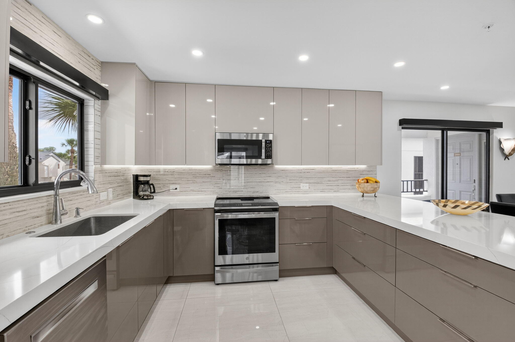 15846 Loch Maree Lane, Unit 2904 Delray Beach, FL 33446 - Photo 13 of 60 a large kitchen with stainless steel appliances granite countertop a sink and cabinets