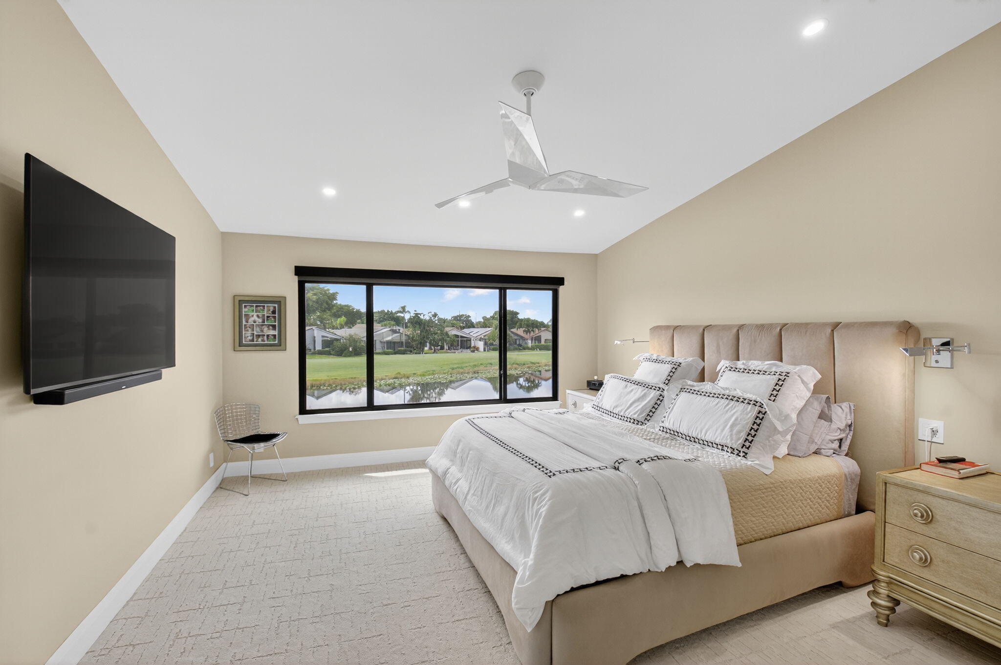 15846 Loch Maree Lane, Unit 2904 Delray Beach, FL 33446 - Photo 26 of 60 a bedroom with a large bed and a flat screen tv