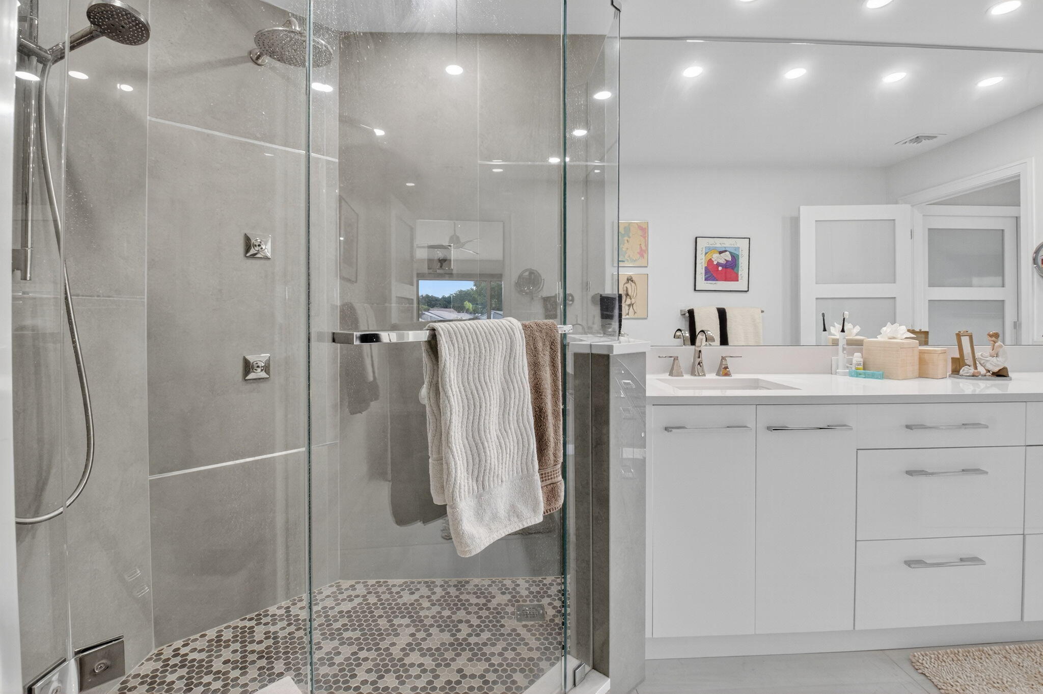 15846 Loch Maree Lane, Unit 2904 Delray Beach, FL 33446 - Photo 30 of 60 a bathroom with a double sink shower and a mirror