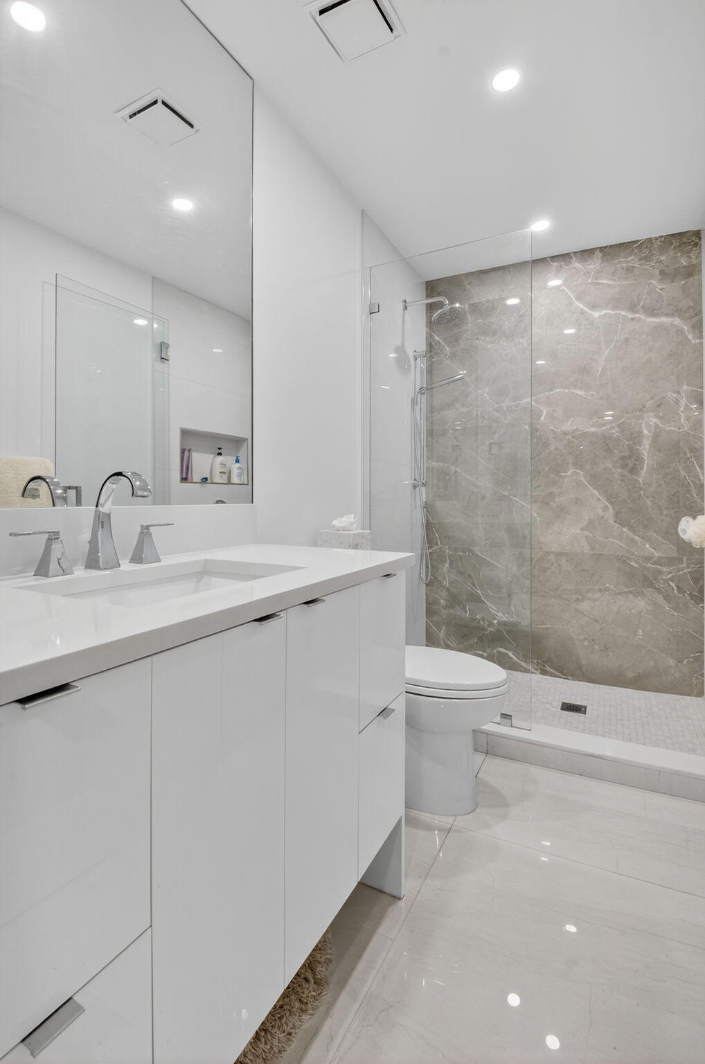 15846 Loch Maree Lane, Unit 2904 Delray Beach, FL 33446 - Photo 36 of 60 a bathroom with a sink a toilet and shower