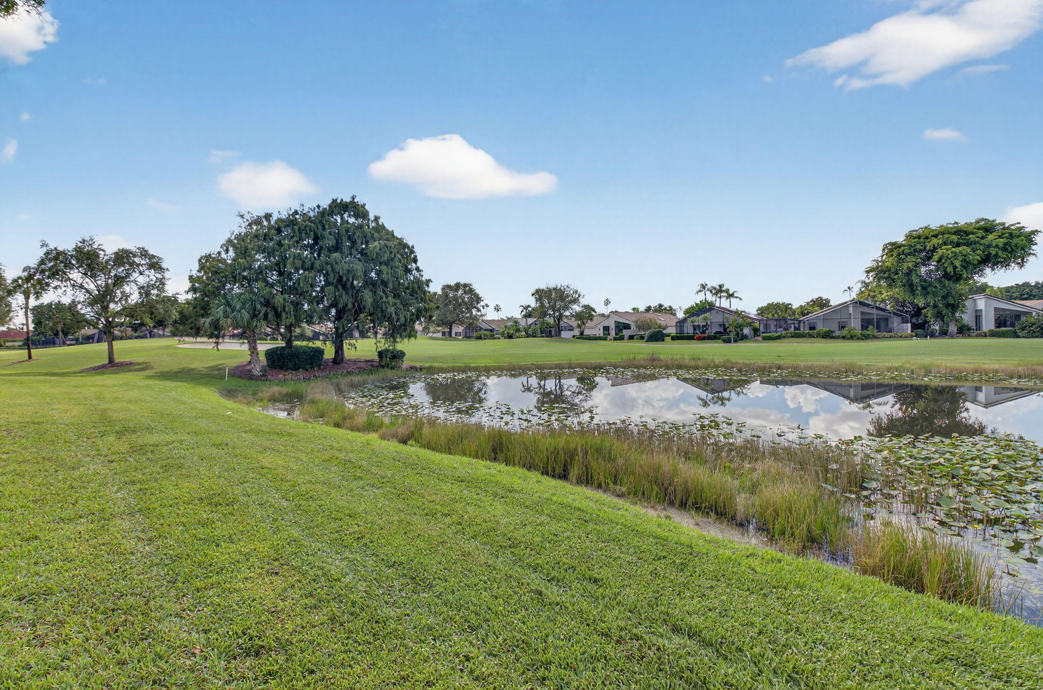 15846 Loch Maree Lane, Unit 2904 Delray Beach, FL 33446 - Photo 40 of 60 a view of a lake with houses in the background