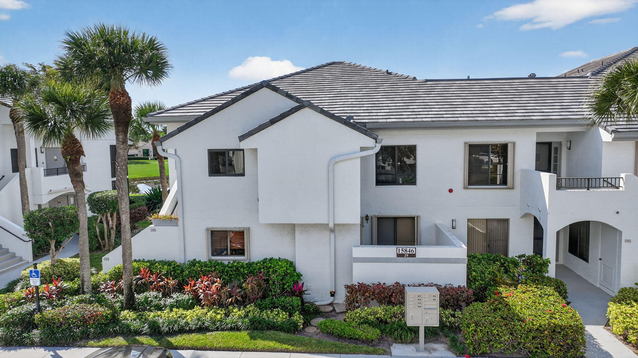 15846 Loch Maree Lane, Unit 2904 Delray Beach, FL 33446 - Photo 55 of 60 a aerial view of a house with a yard and potted plants