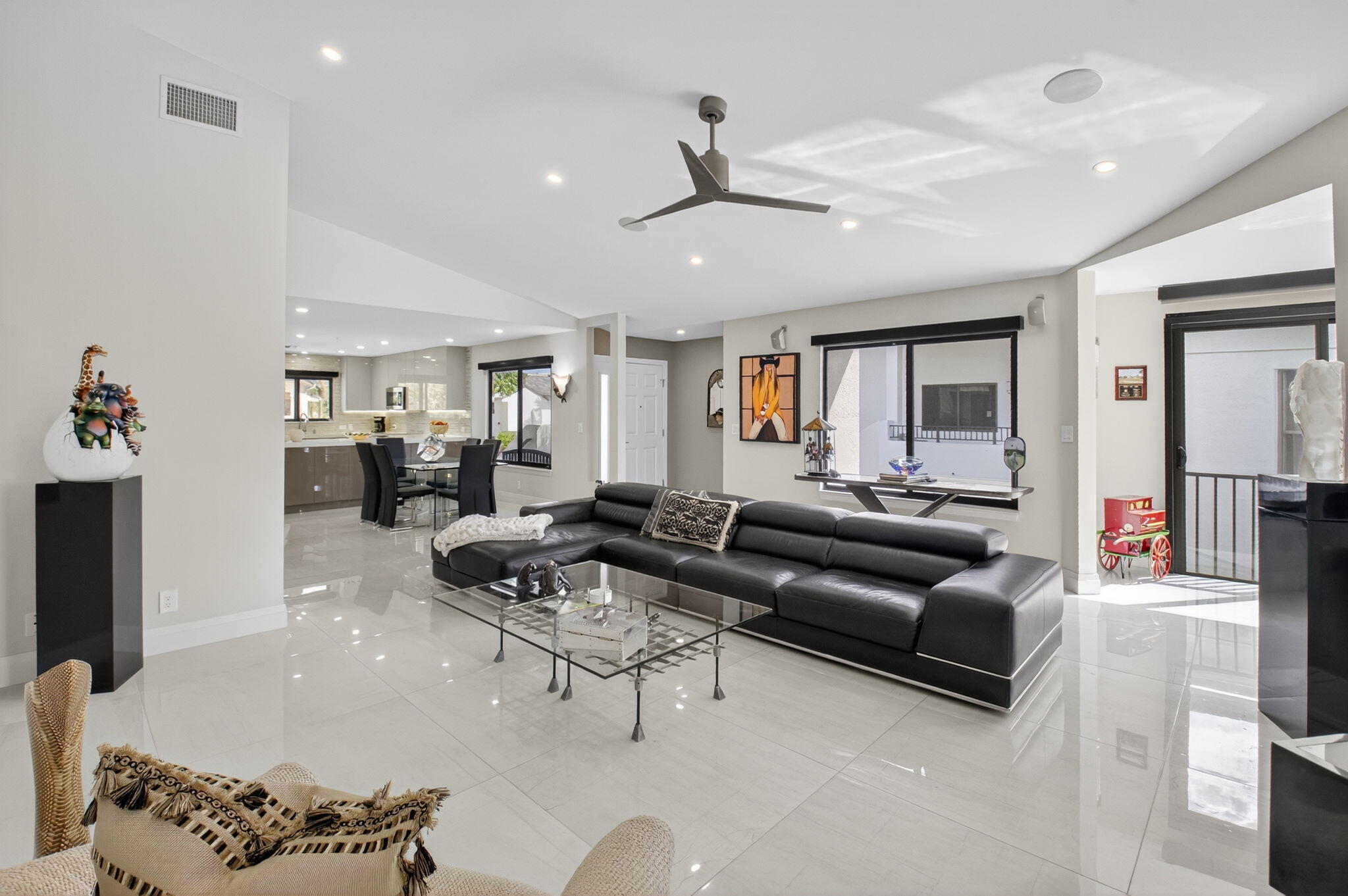15846 Loch Maree Lane, Unit 2904 Delray Beach, FL 33446 - Photo 6 of 60 a living room with furniture kitchen view and a chandelier