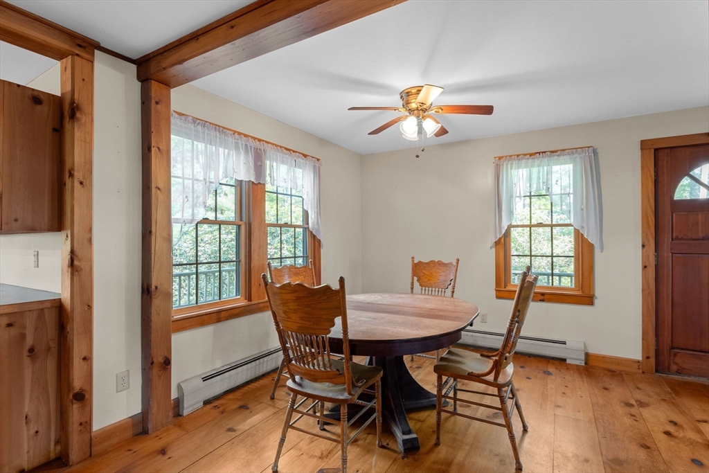 362 Snows Pond Road Rochester, MA 02770 - Photo 8 of 41 a view of a dining room with furniture window and outside view