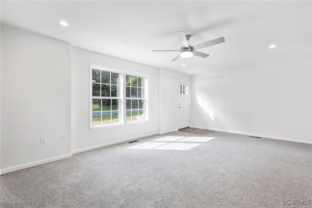 64 Pine Road Louisa, VA 23093 - Photo 12 of 45 an empty room with windows and ceiling fan