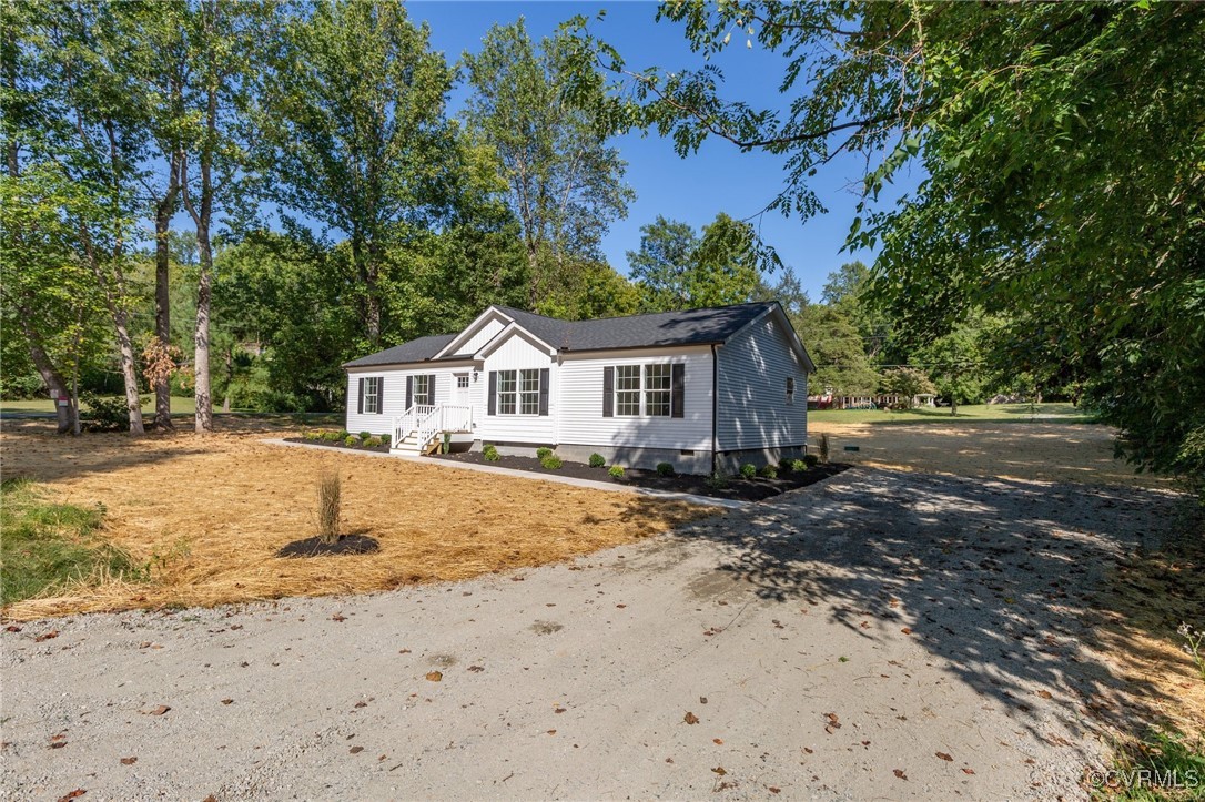 64 Pine Road Louisa, VA 23093 - Photo 2 of 45 a view of house with backyard and trees