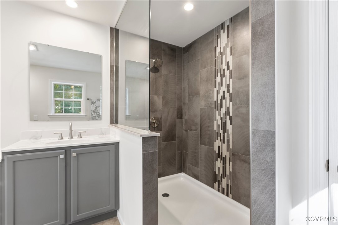 64 Pine Road Louisa, VA 23093 - Photo 34 of 45 a bathroom with a double vanity sink toilet and shower