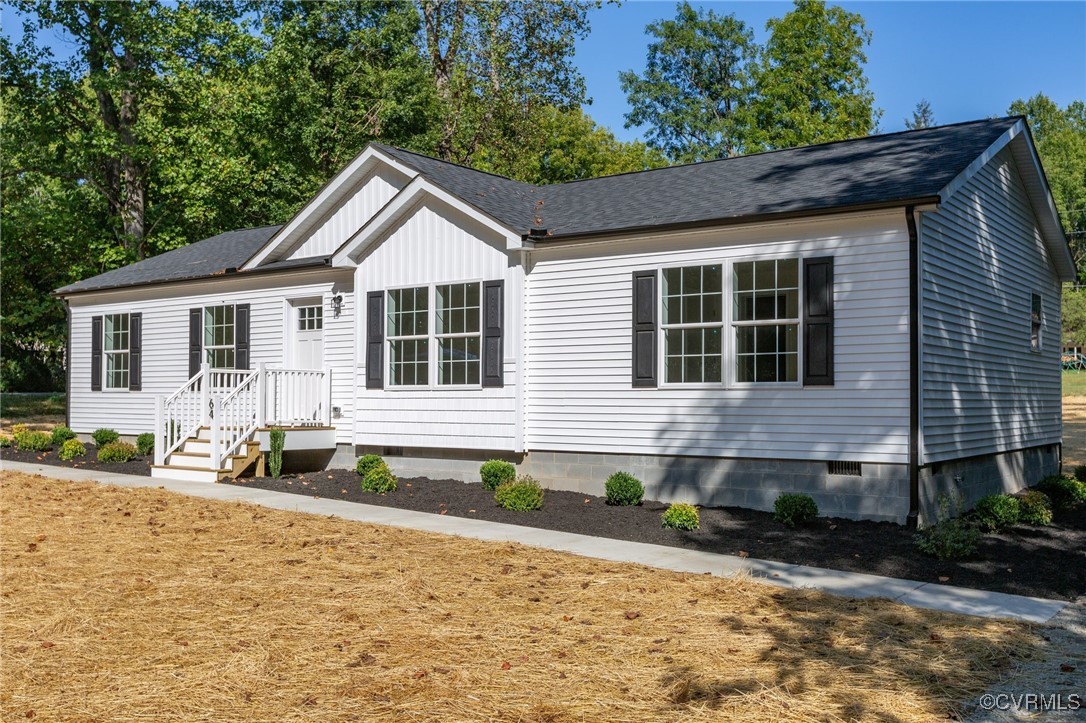 64 Pine Road Louisa, VA 23093 - Photo 36 of 45 a front view of a house with a yard and outdoor seating