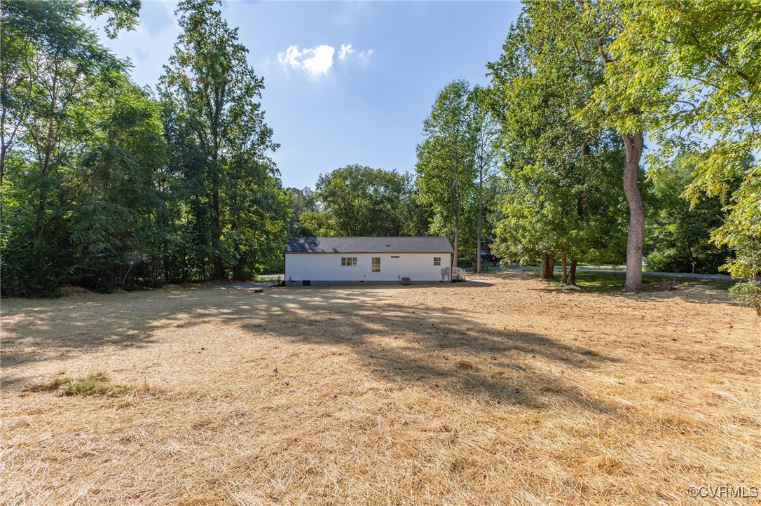 64 Pine Road Louisa, VA 23093 - Photo 41 of 45 a wooden bench sitting in middle of a yard