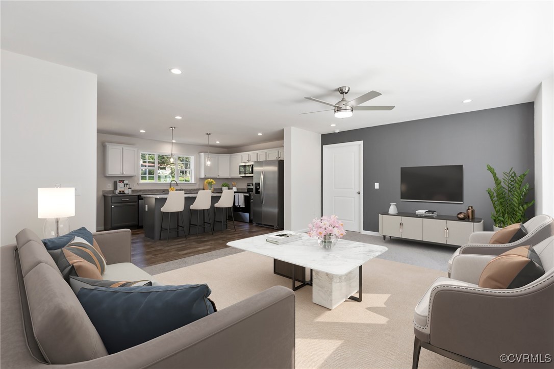 64 Pine Road Louisa, VA 23093 - Photo 10 of 45 a living room with furniture kitchen view and a flat screen tv