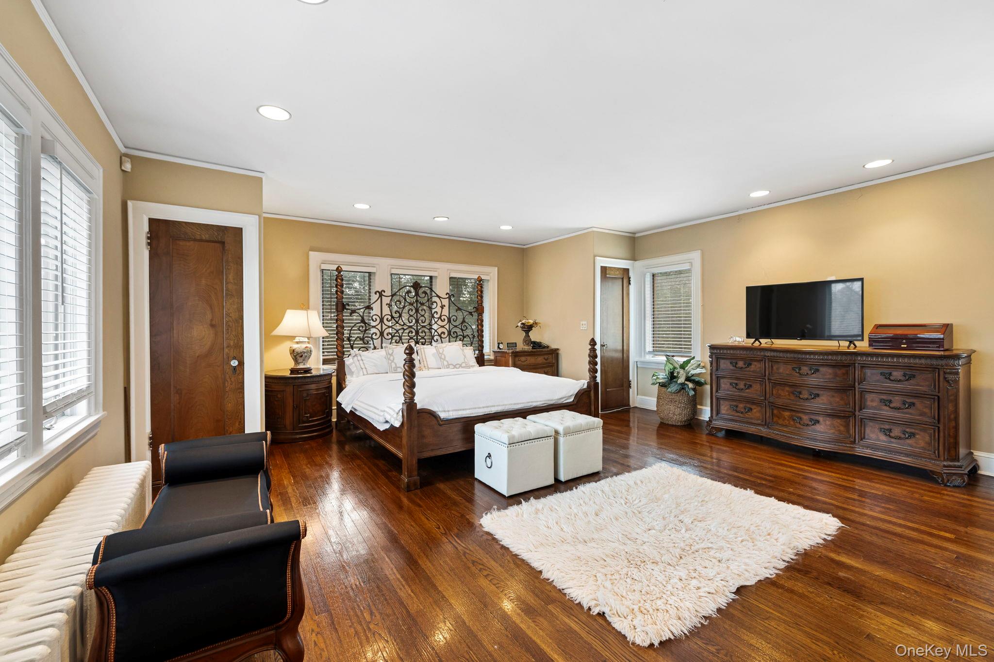 44 Fenimore Road New Rochelle, NY 10804 - Photo 19 of 46 a living room with furniture and a flat screen tv