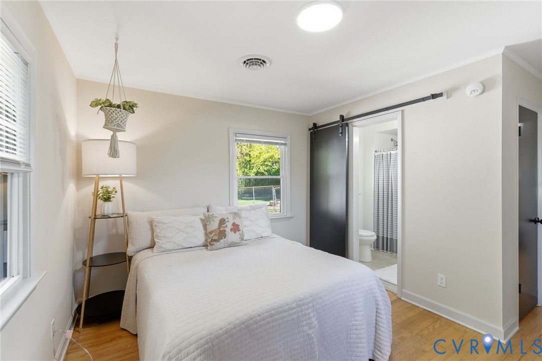8456 Atlee Road Mechanicsville, VA 23116 - Photo 11 of 28 a bedroom with a bed and a window