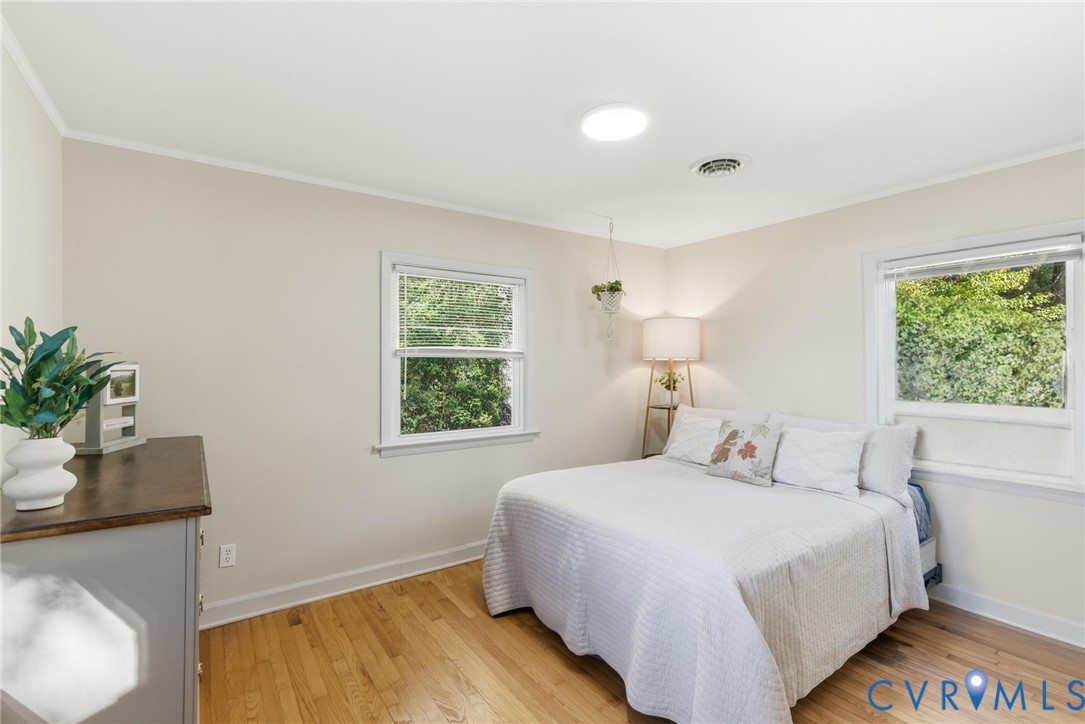 8456 Atlee Road Mechanicsville, VA 23116 - Photo 12 of 28 a bedroom with a bed and a potted plant